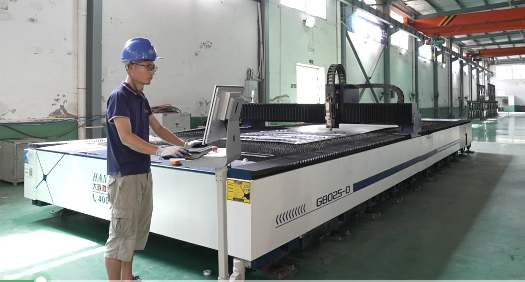 CNC precision laser cutting at the Hexin workshop