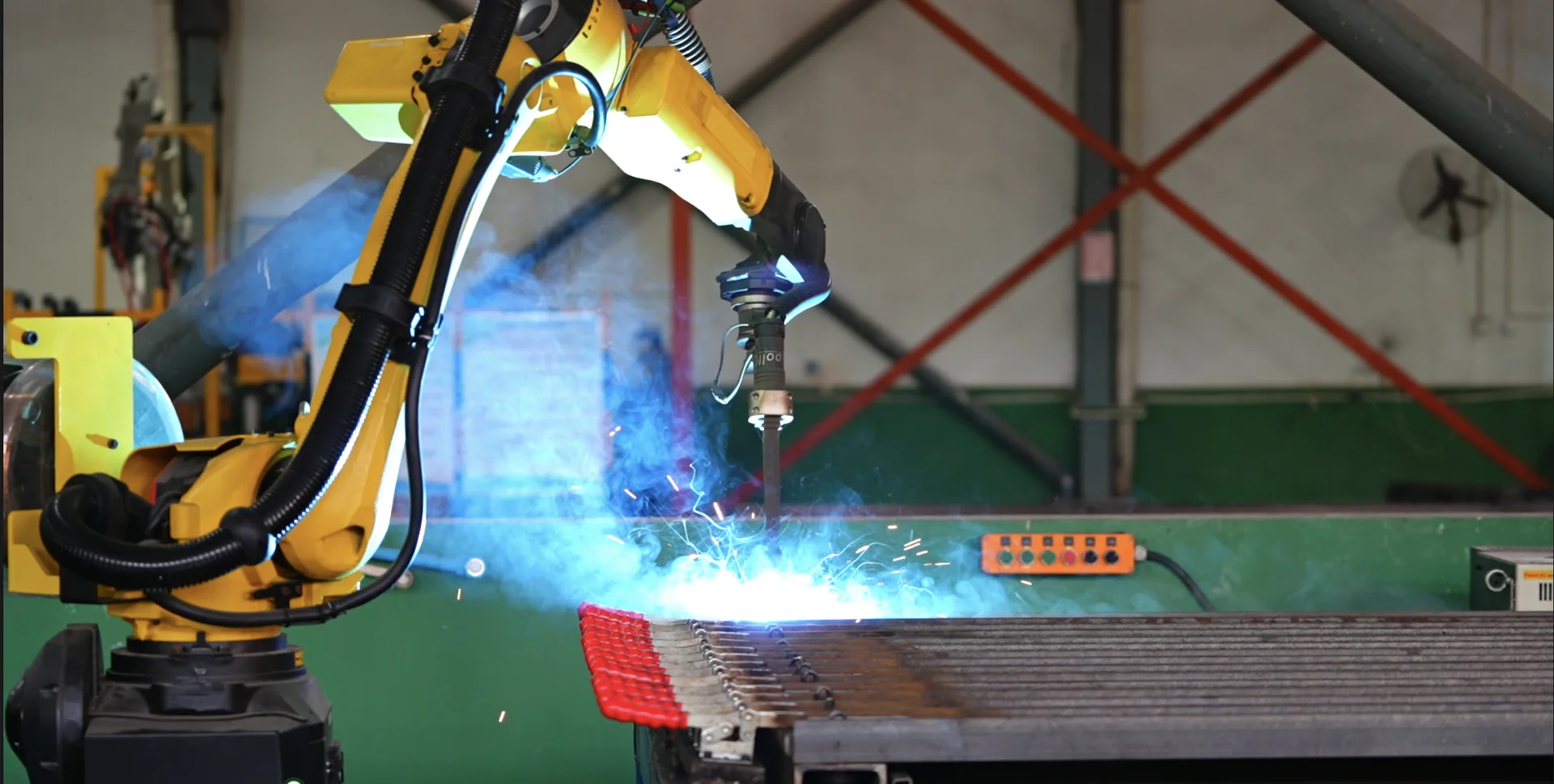 Close-up of robotic welding for a steel component