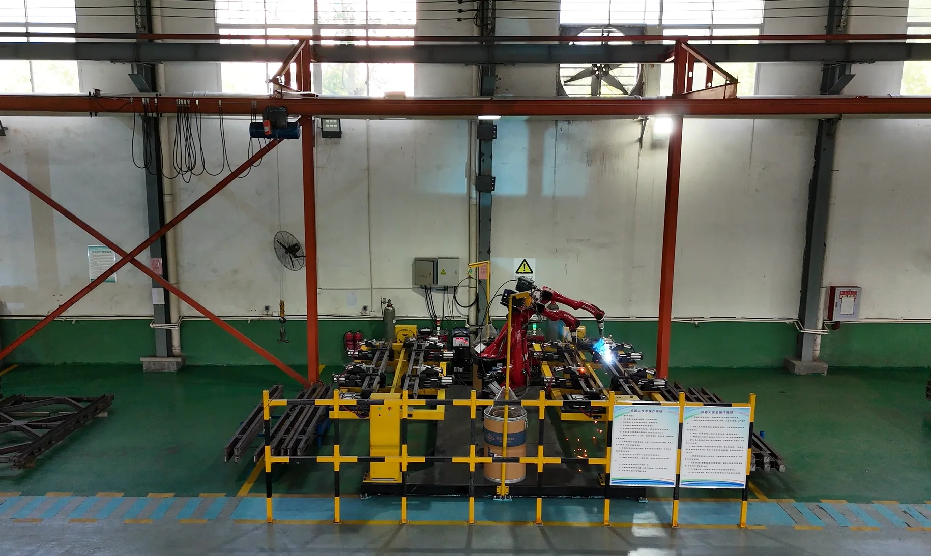 Dual-robot automated welding station at the Hexin workshop